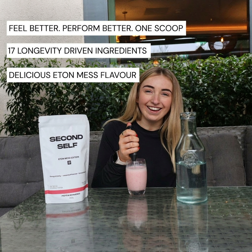 Smiling woman stirring a pink protein shake next to a second self product and water carafe