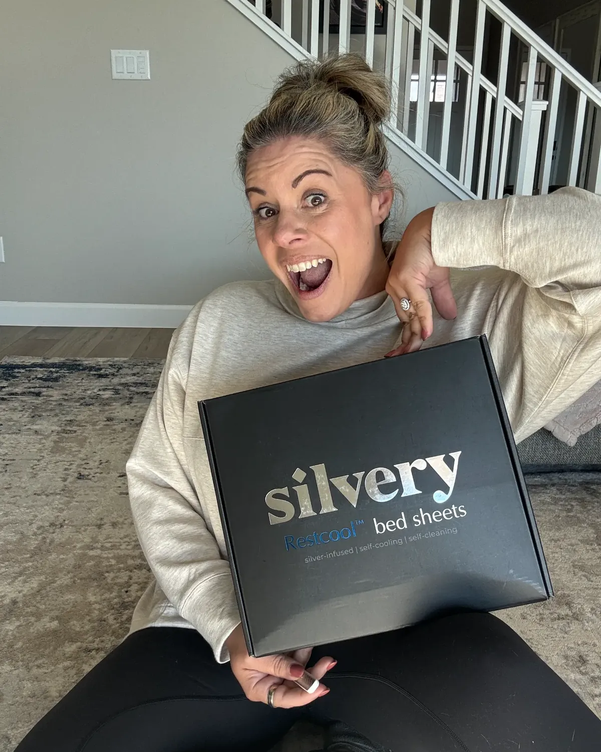 Silvery customer at home with their silver-infused bedding