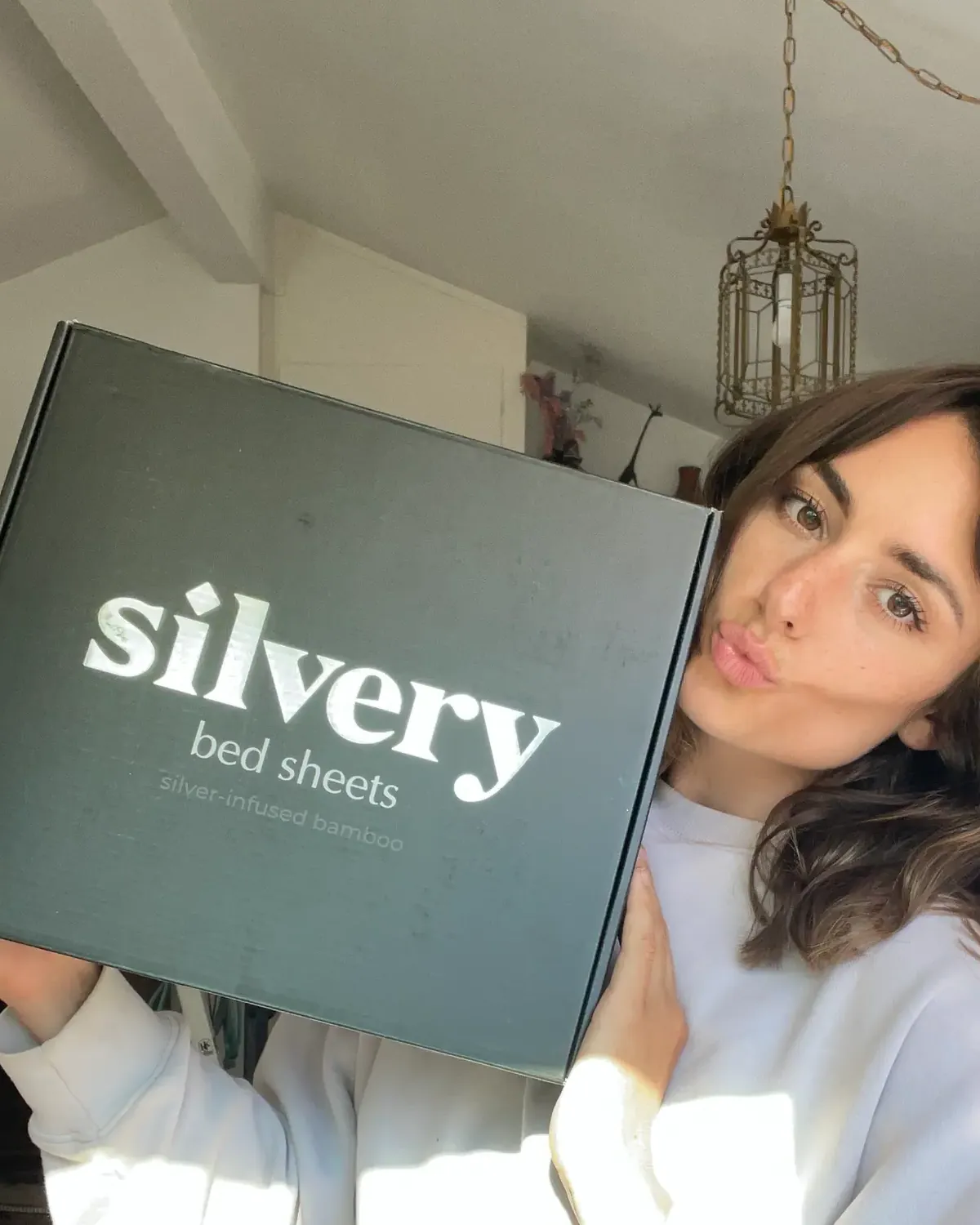 Silvery customer at home with their silver-infused bedding