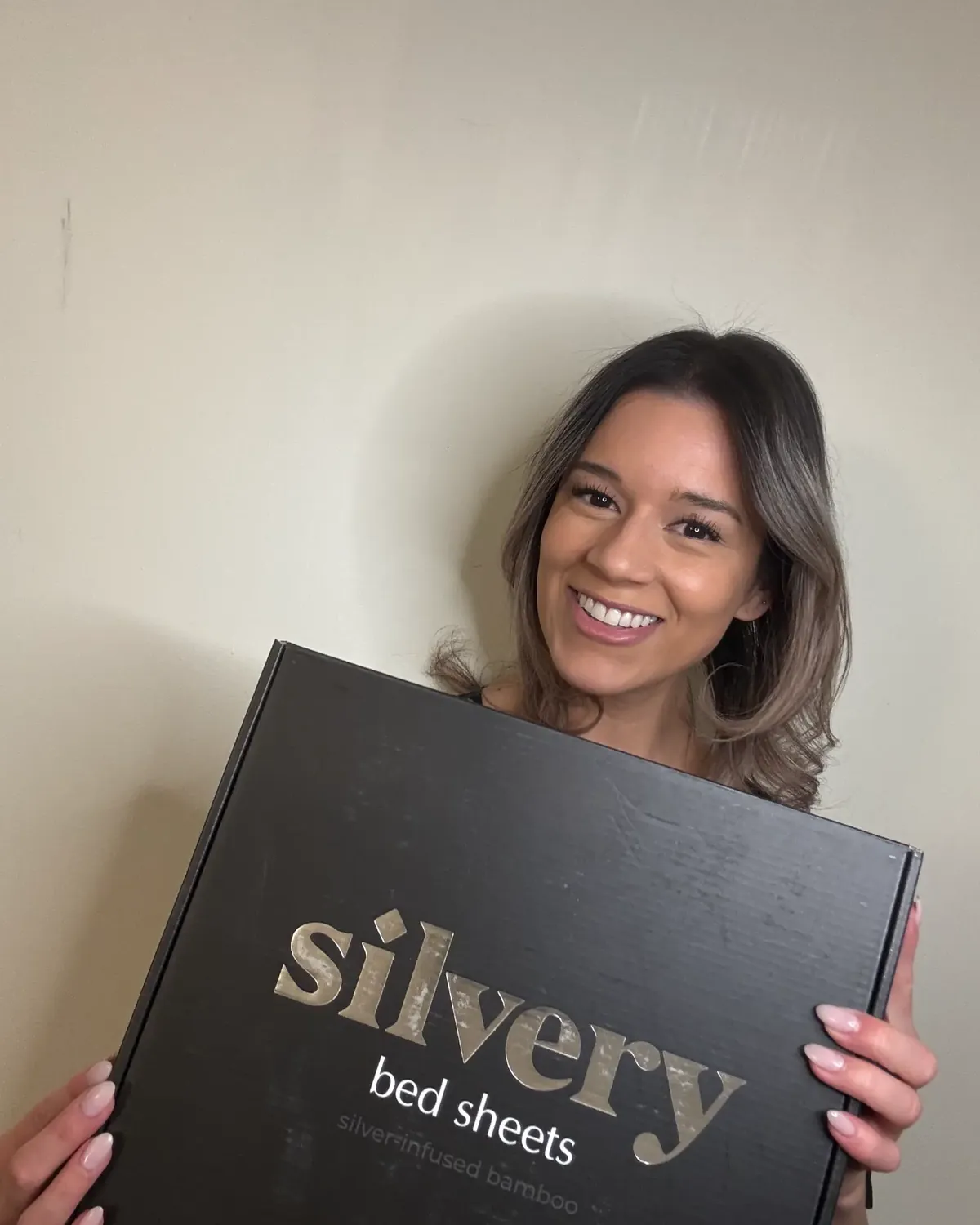Silvery customer at home with their silver-infused bedding