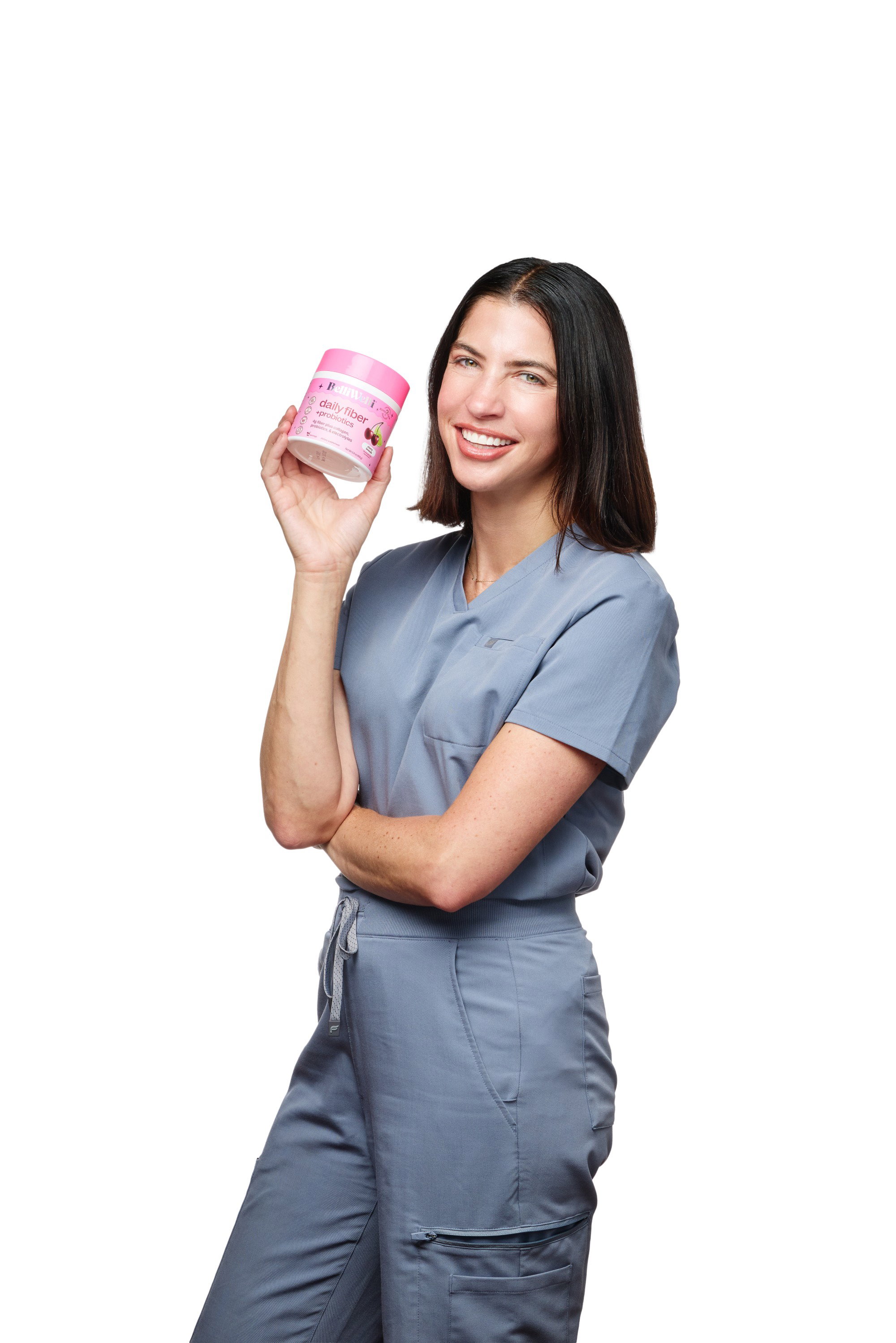 Dr. Jennah Siwak smiling and holding up a tub of BelliWelli Cherry Limeade fiber powder