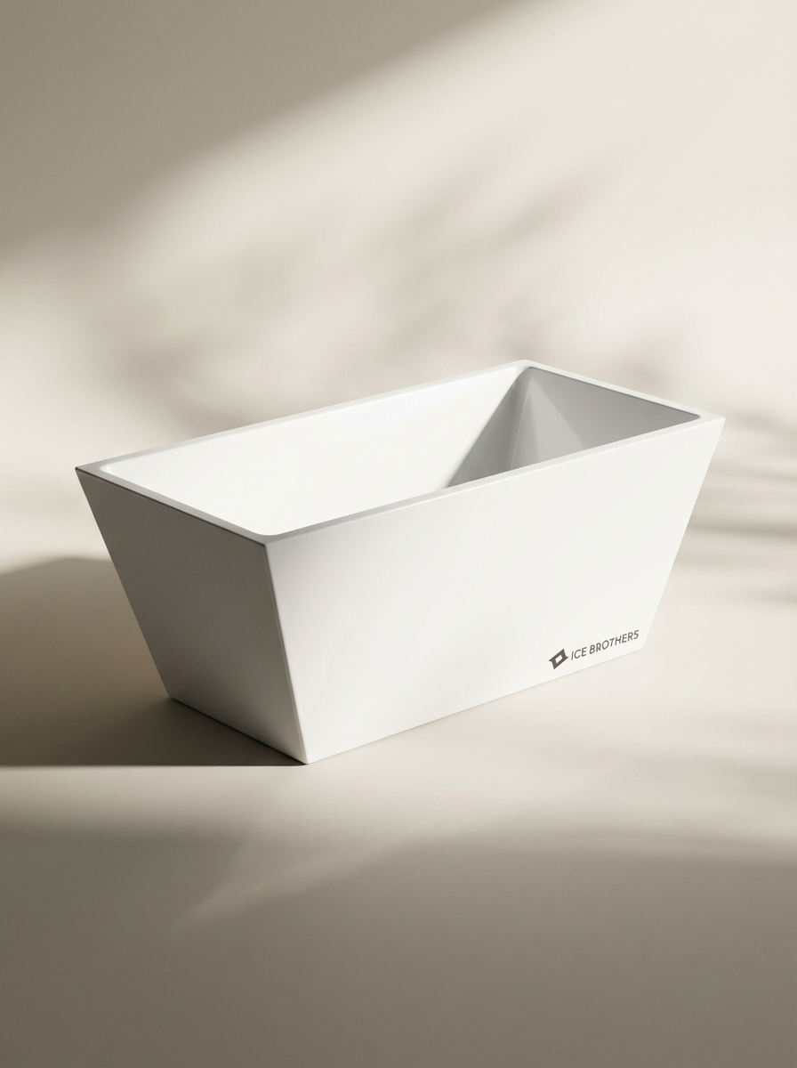 A sleek, white, rectangular ice bucket with angled sides and brand logo