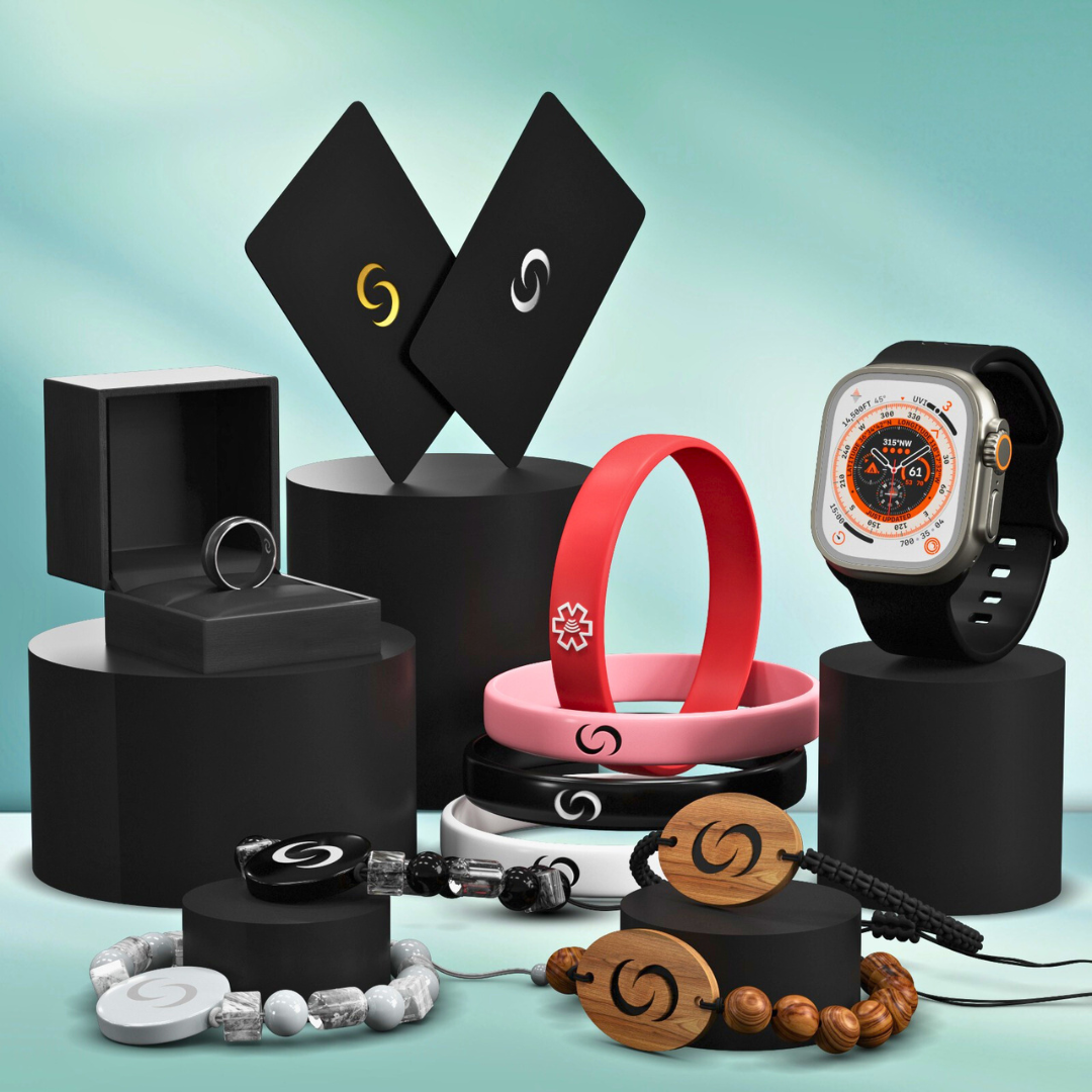Smart NFC cards, rings, bands, bracelets and keychains displayed on black pedestals