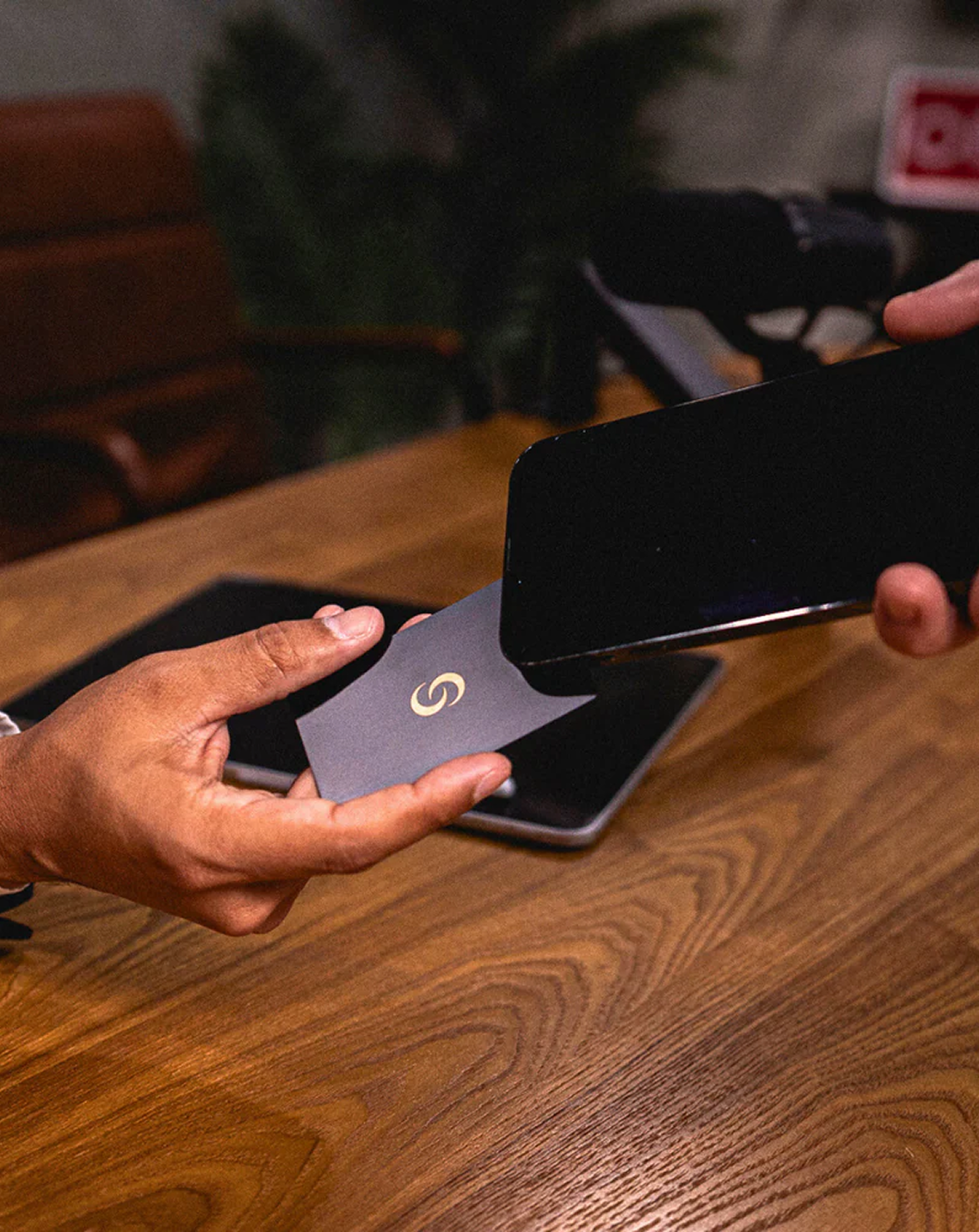 Tapping the Contact Co. metal business card to a phone
