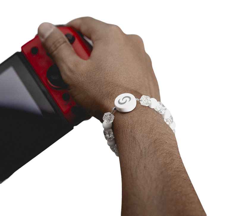 White beaded smart bracelet worn while gaming