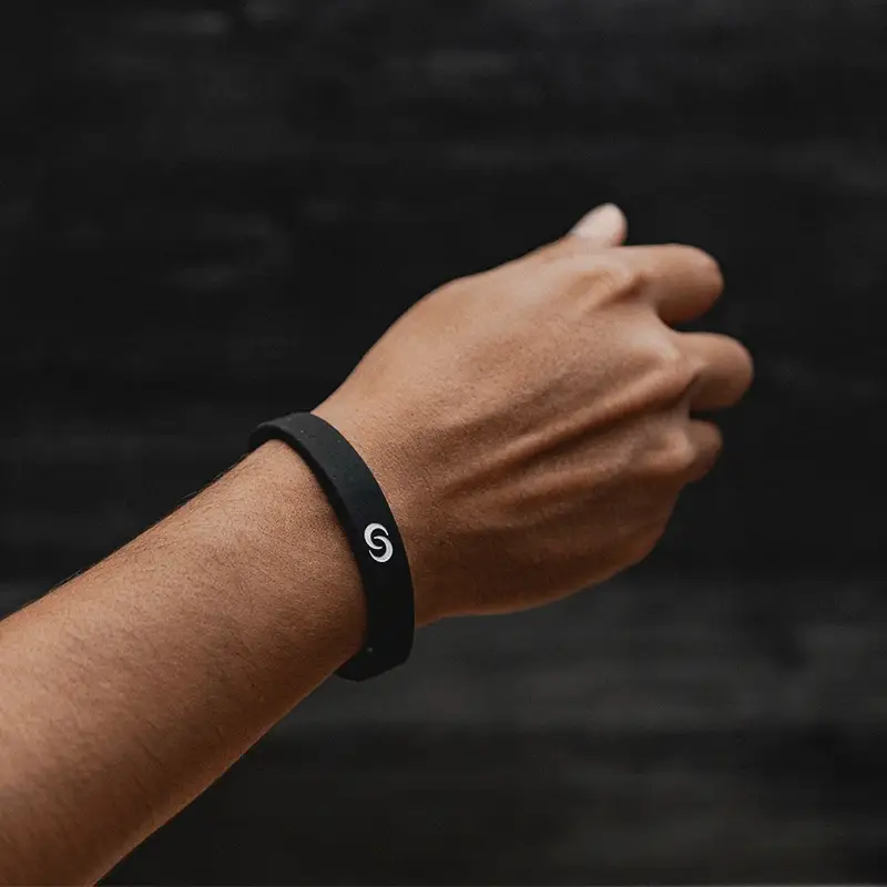 Wrist wearing a black Contact Co. NFC silicone band