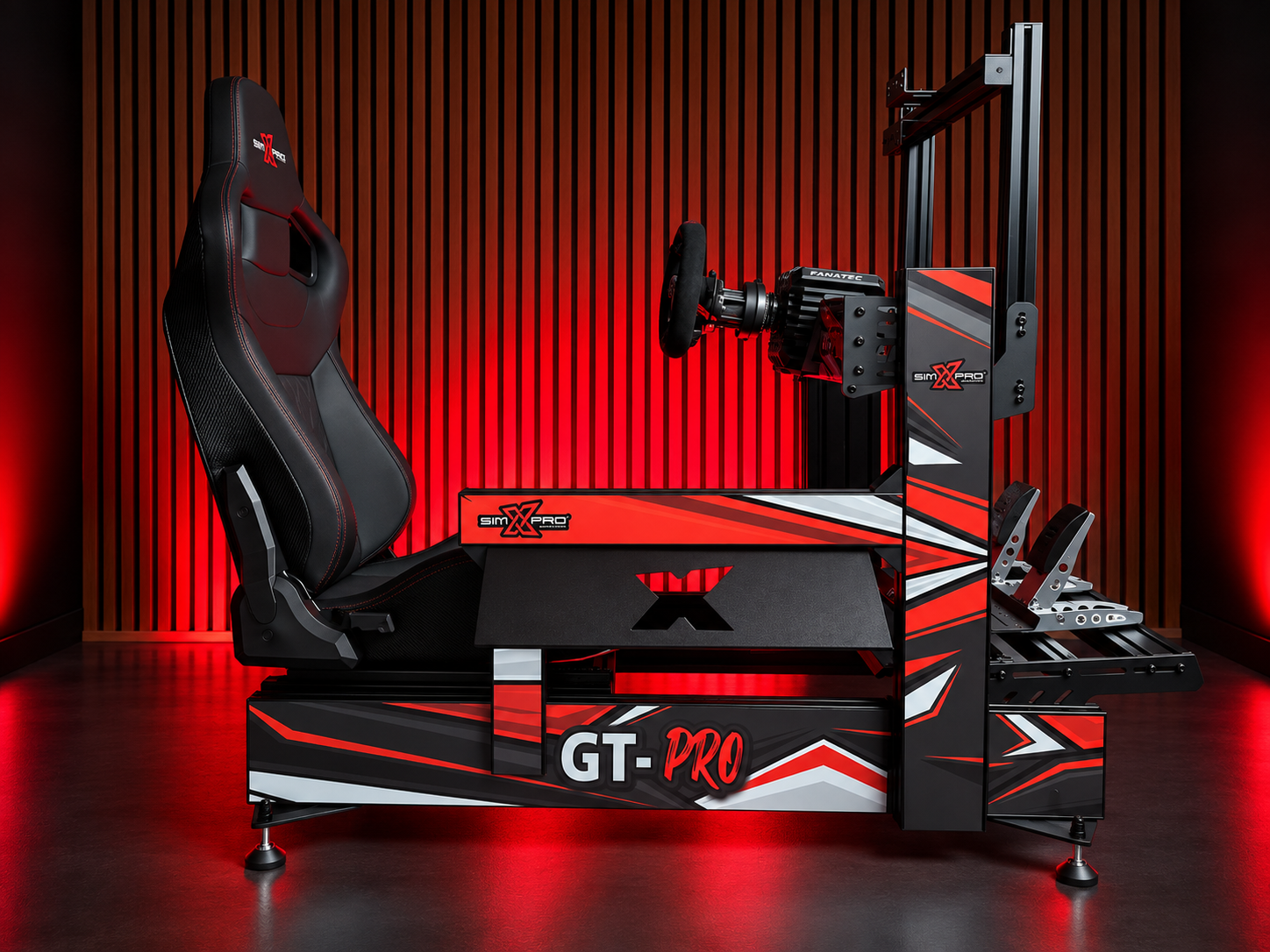 SimXPro GT-Pro sim racing cockpit with racing seat, Fanatec wheel base and pedals in a red-lit studio