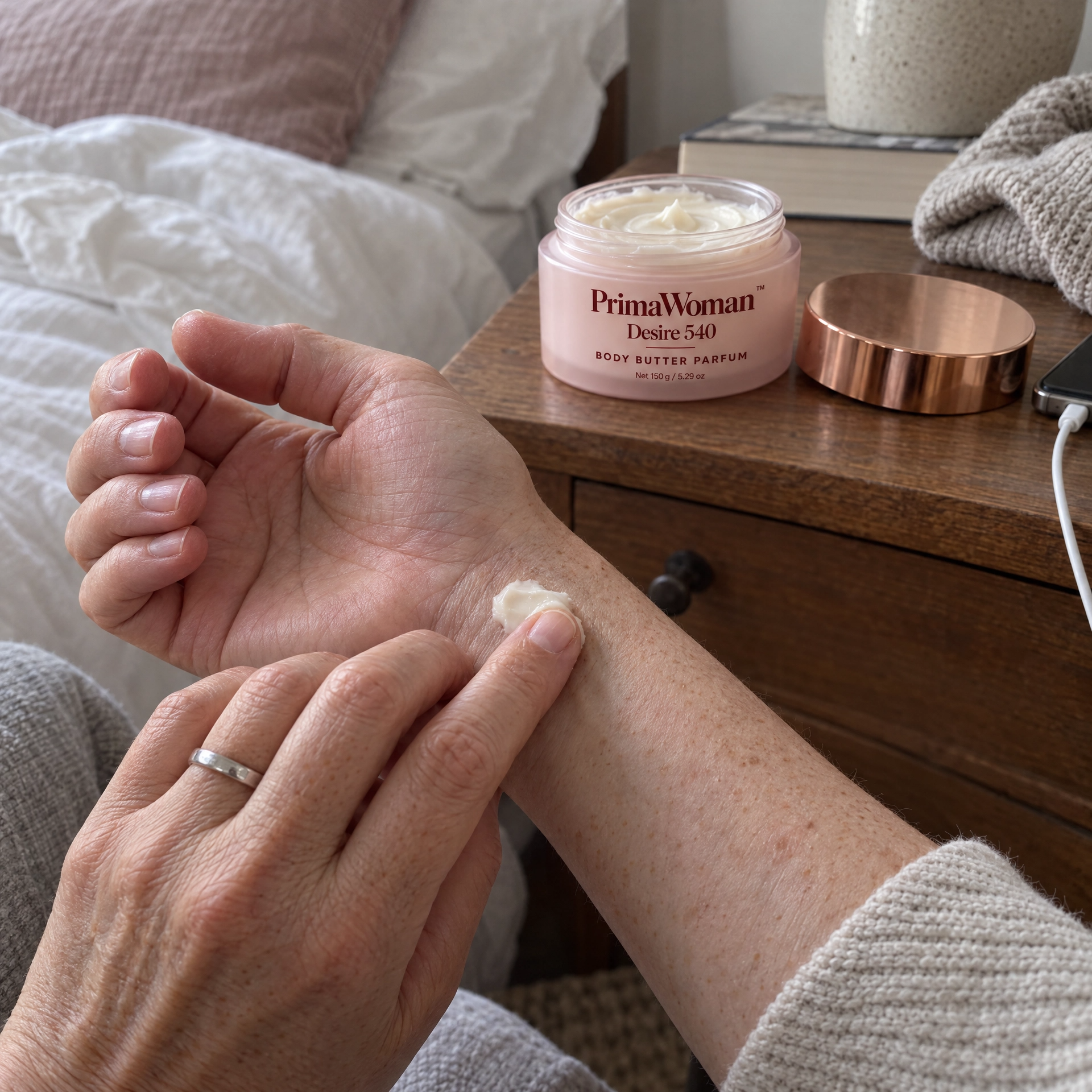 Customer applying body butter before a night out