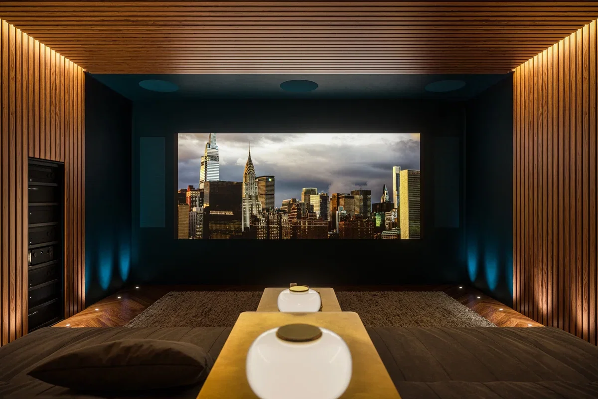 Media room with a large screen, black slatted acoustic wall, tower speakers and a subwoofer