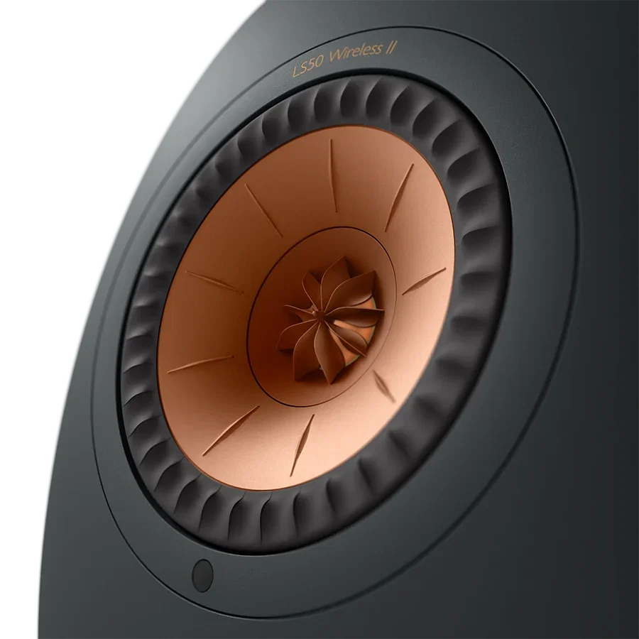 Close-up of the copper Uni-Q driver on a black KEF LS50 Wireless II speaker, with the finned tweeter at the center of the midrange cone