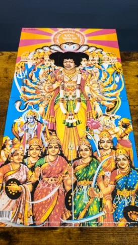 The gatefold cover of Jimi Hendrix's Axis: Bold as Love opened flat on a wooden table, showing its vivid, colorful artwork
