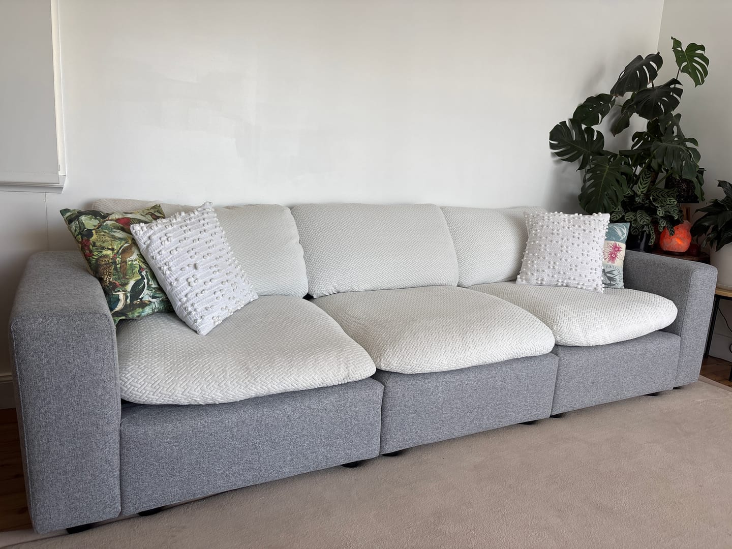 A customer’s couch with a CouchCoats cover, shared by @casa.m.aus