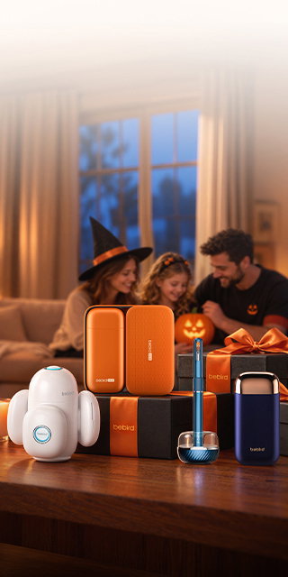 Family carving a jack-o'-lantern on the sofa behind Bebird ear cleaners and orange-ribboned gift boxes on a wooden table