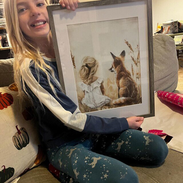 Girl holding her framed custom fox print