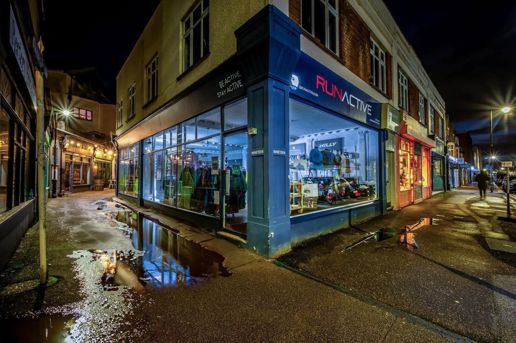 The RunActive shopfront on the corner of Rectory Grove, Leigh-on-Sea, lit up at night
