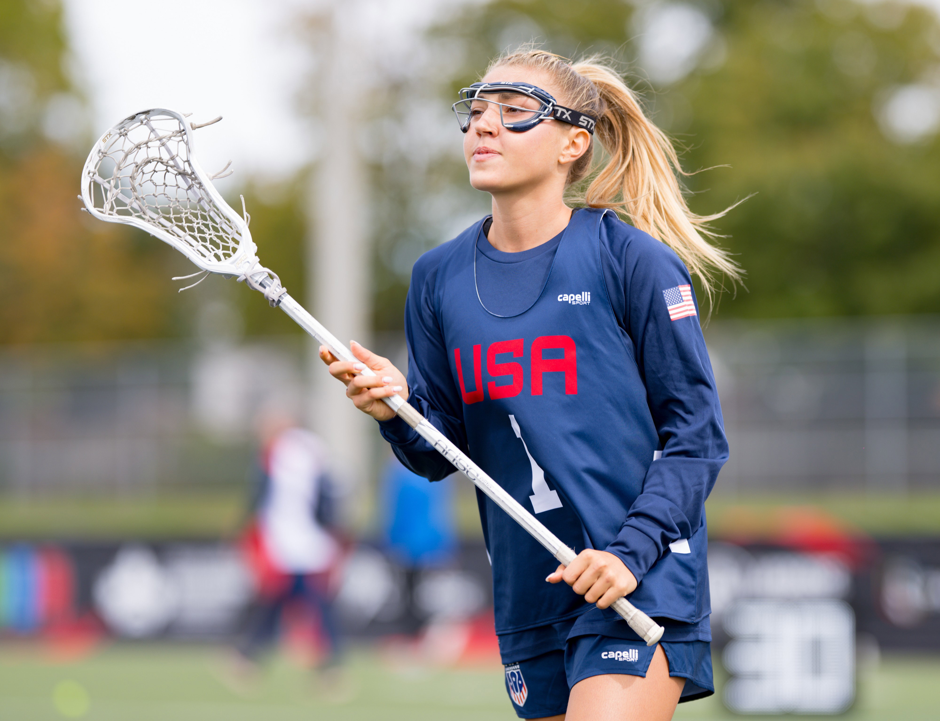Chloe Humphrey in her Team USA No. 1 jersey cradling her white STX stick in warmups