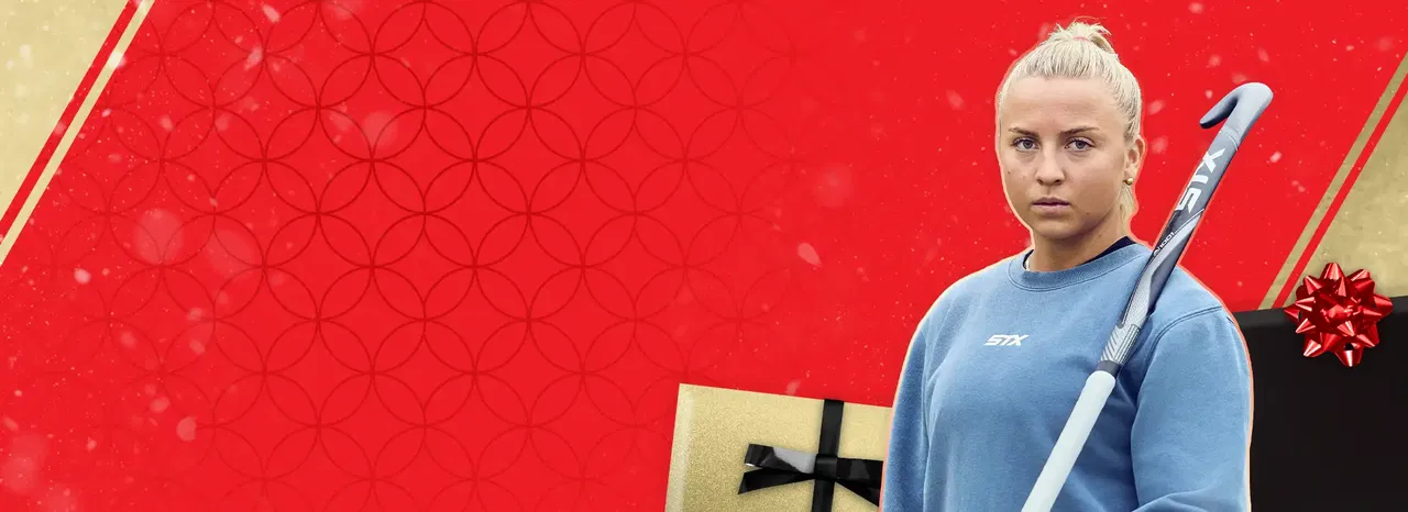 field hockey female athlete with stick and holiday imagery