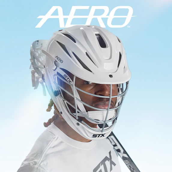 athlete wearing white stx aero lacrosse helmet
