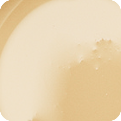 Close-up of creamy colostrum with a smooth and slightly textured surface.