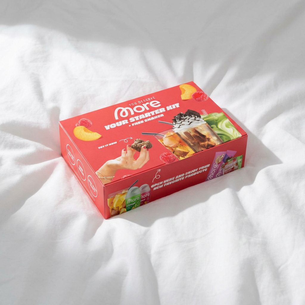 Red box labeled More Starter Kit with images of snacks and drinks on a white fabric surface