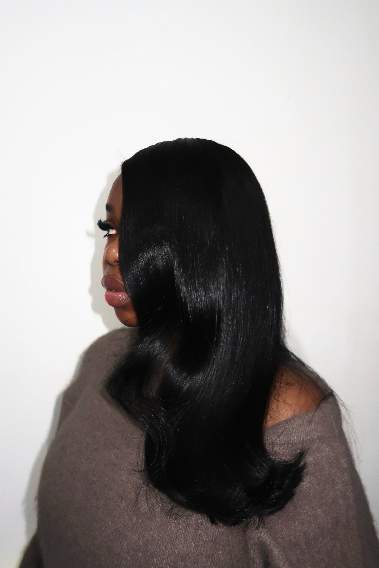 Sleek glossy black hair with soft curled ends by RawHause