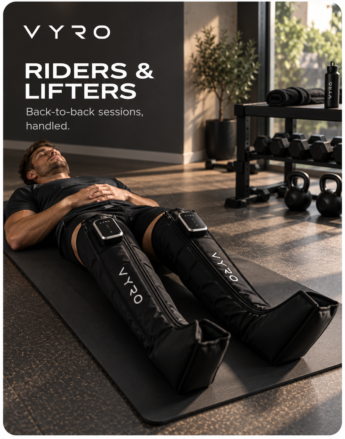 Athlete resting on a mat in a sunlit home gym beside dumbbells and kettlebells, wearing VYRO compression boots