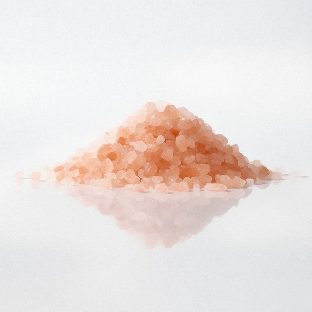Pile of potassium chloride crystals on a white reflective surface.