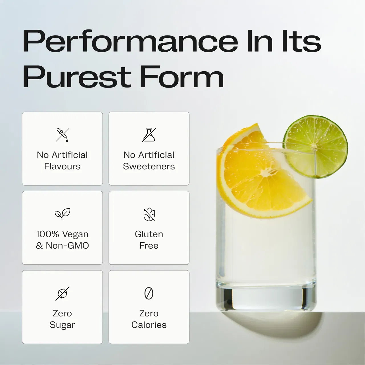 Glass of water with lemon and lime slices, with text highlighting no artificial flavors, sweeteners, gluten, sugar, calories, 100% vegan and non-GMO.