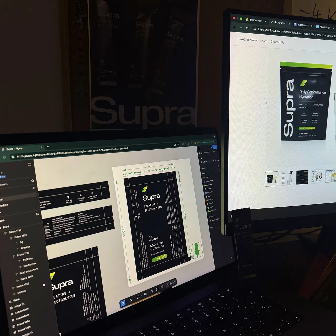 Laptop and monitor displaying design work for Supra creatine and electrolytes product packaging.