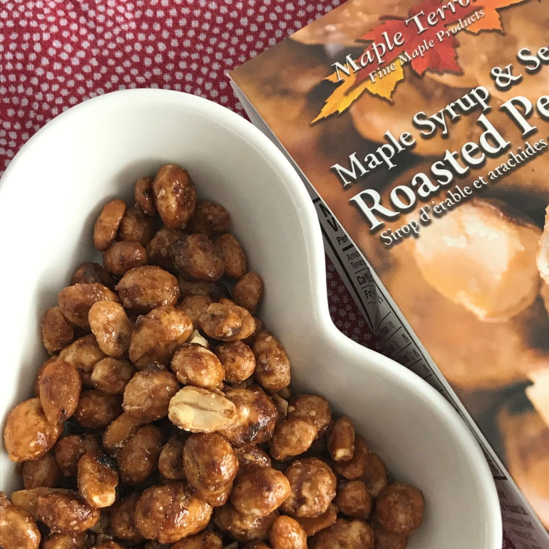 Maple Roasted Peanuts on table in heart shaped white bpo