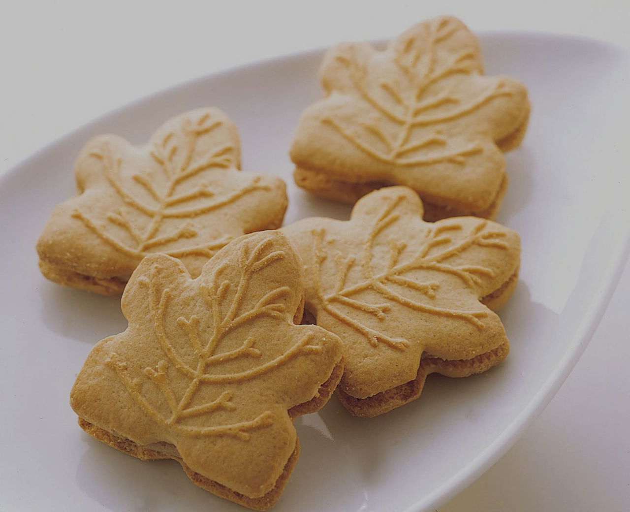 Maple Cookies on white dish in white room