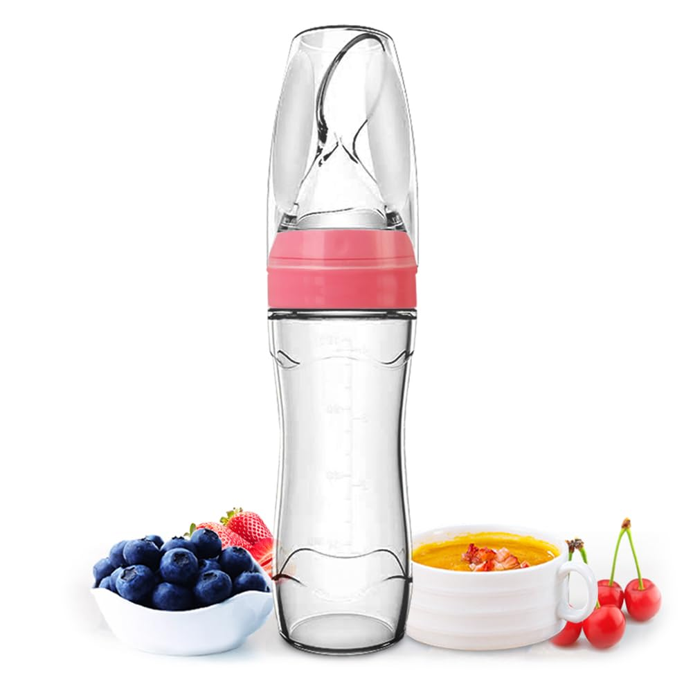 Squeeze feeder bottle beside fresh berries and purée (pink collar)