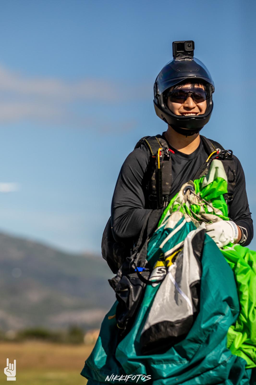 Portrait of Joseph Lee, smiling in his skydiving helmet