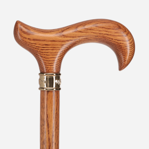 cane stands out clearly from the honey-colored wood 