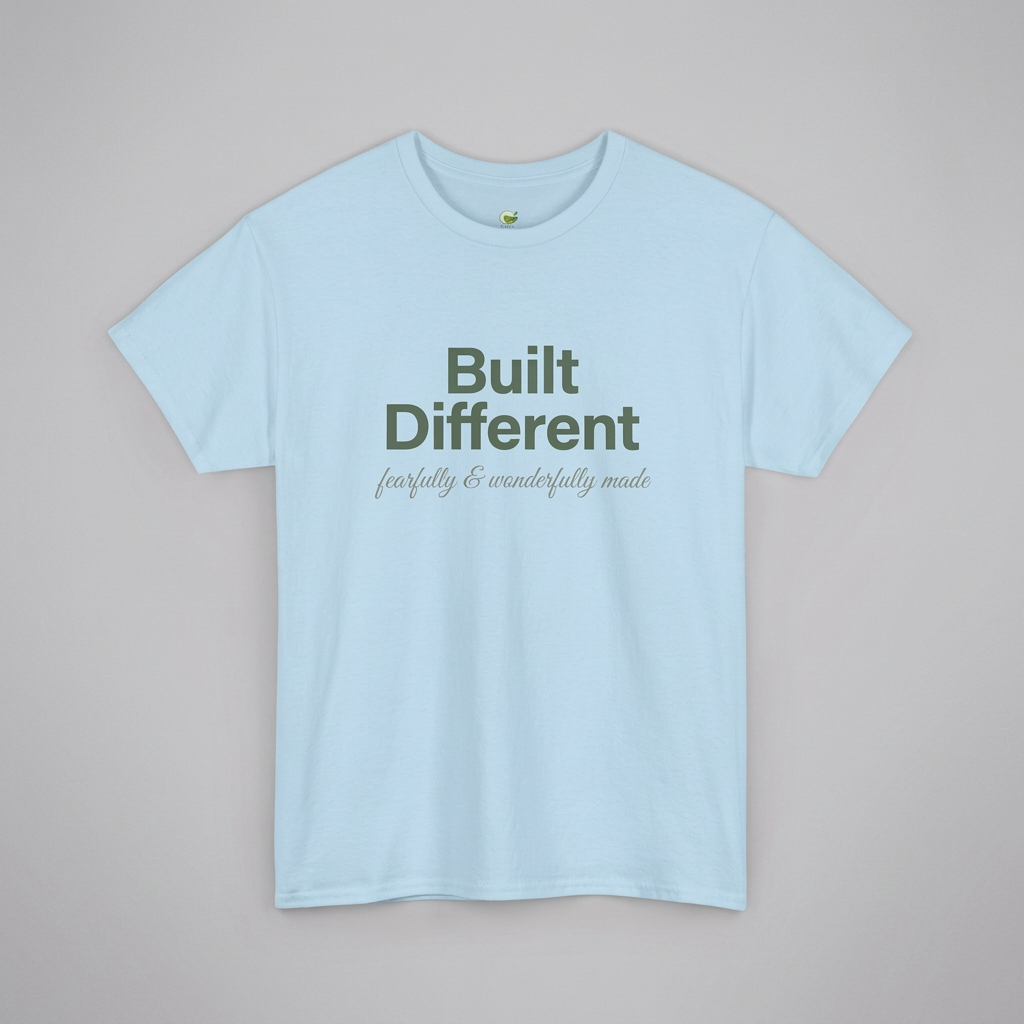 Light blue T-shirt with text 'Built Different fearfully & wonderfully made' printed in green and gray