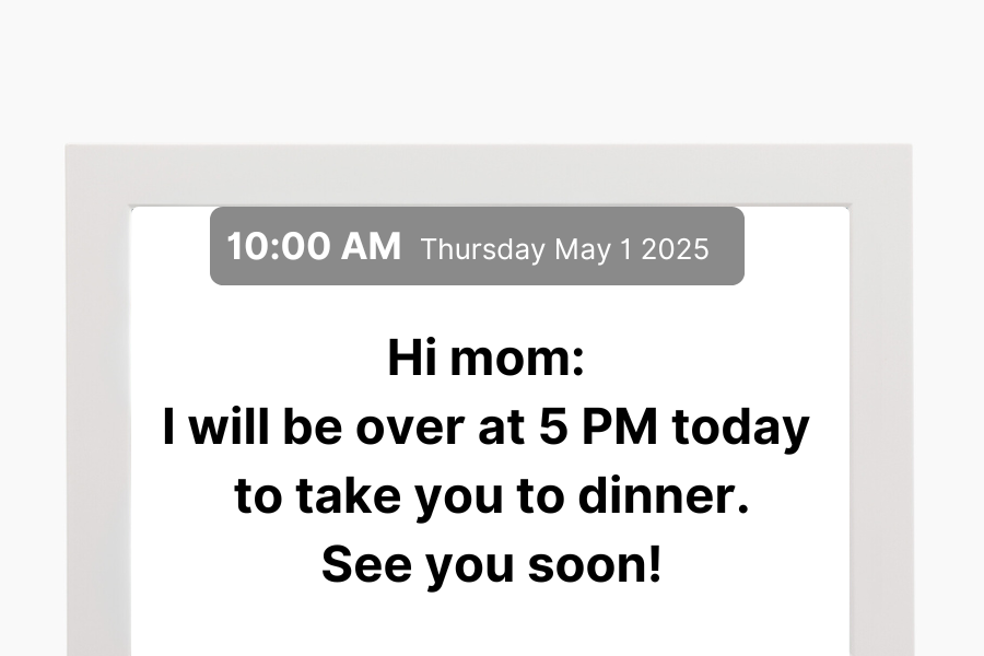 Memoryboard digital message screen showing a note about dinner plans.