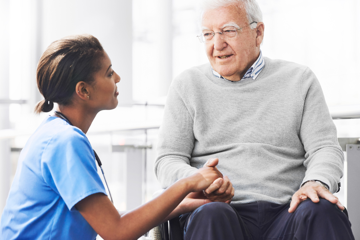Dementia patient and caregiver talking about reminder boards.