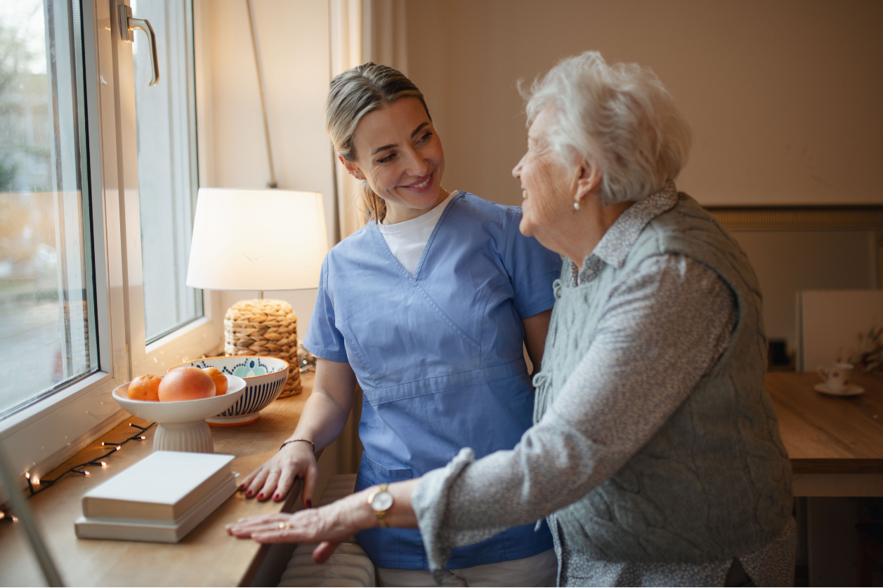 Dementia patient and caregiver reviewing daily reminders for the day.