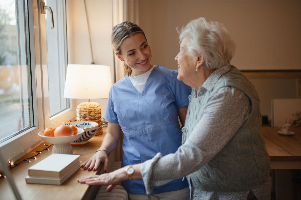 Dementia patient with a caregiver talking about reminders and daily schedules.