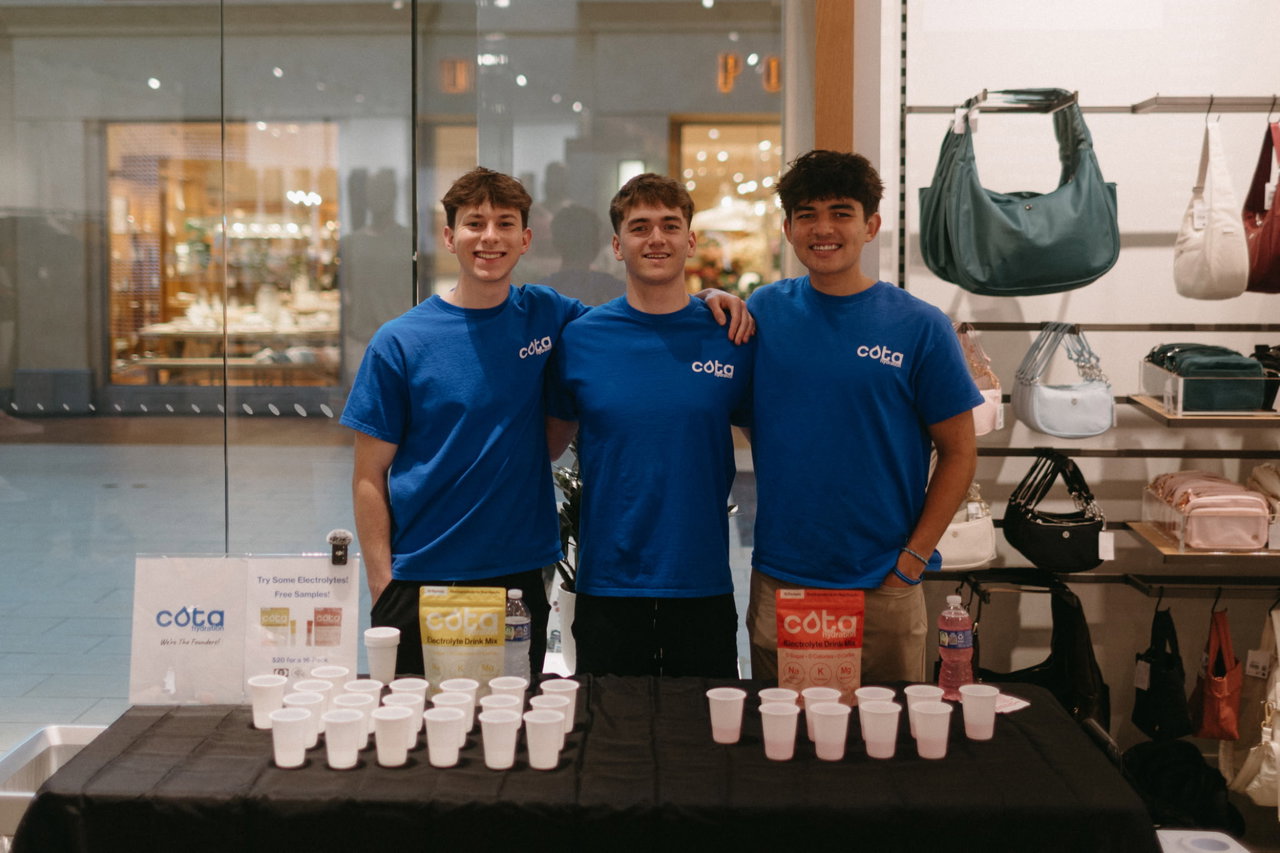 Cota Hydration founds standing at event table