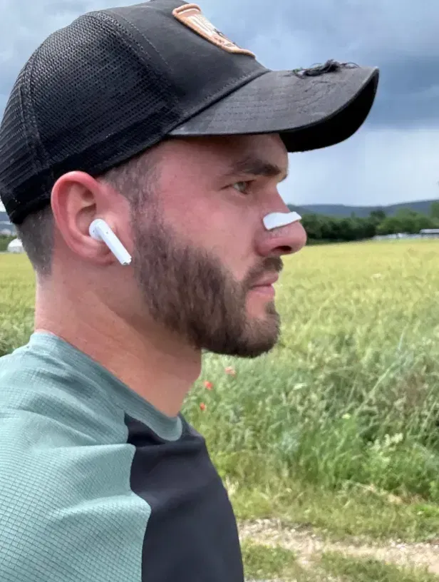 Man wearing white nasal strip during a walk