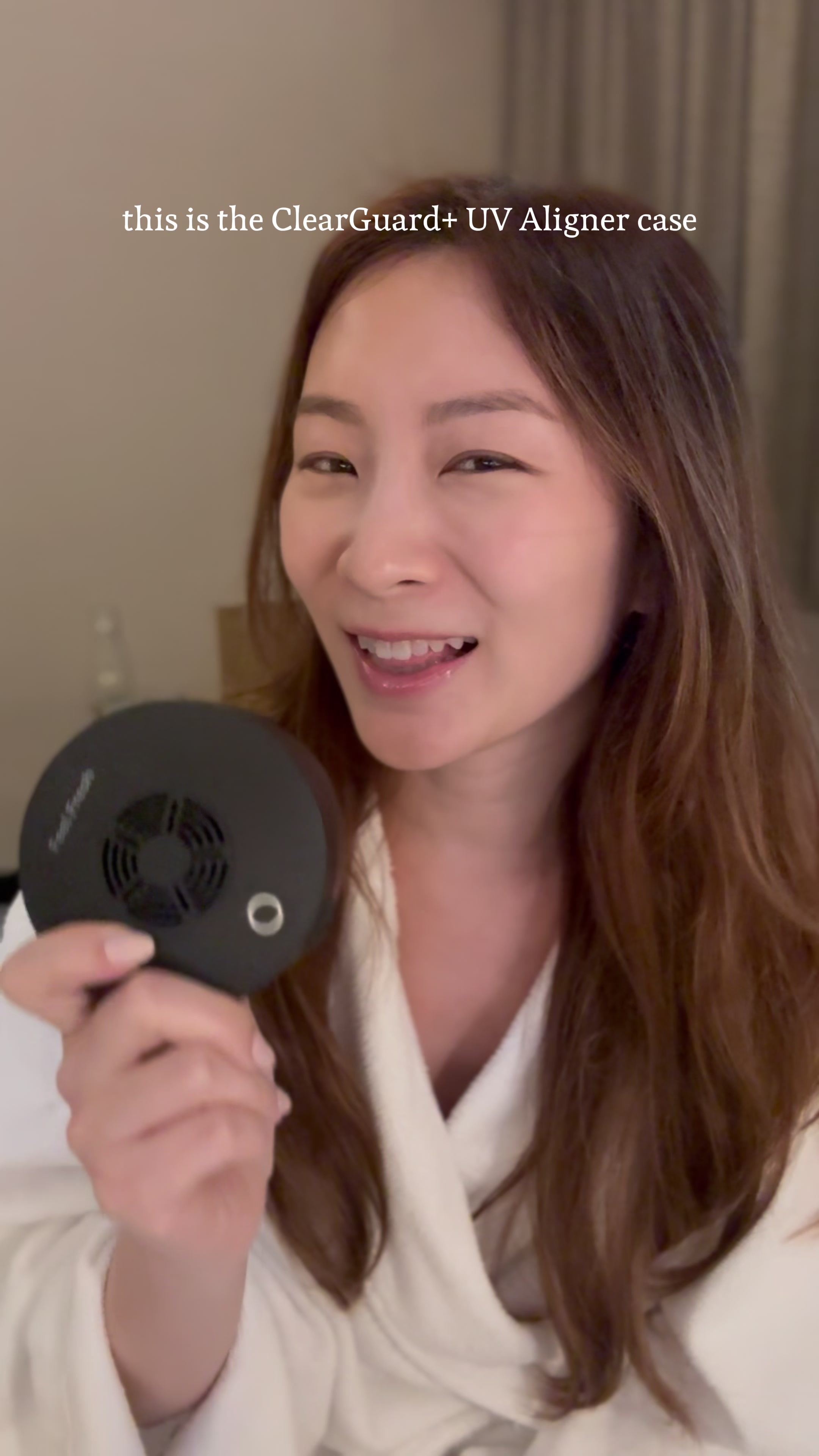 Couple brushing their teeth together with sonic electric toothbrushes