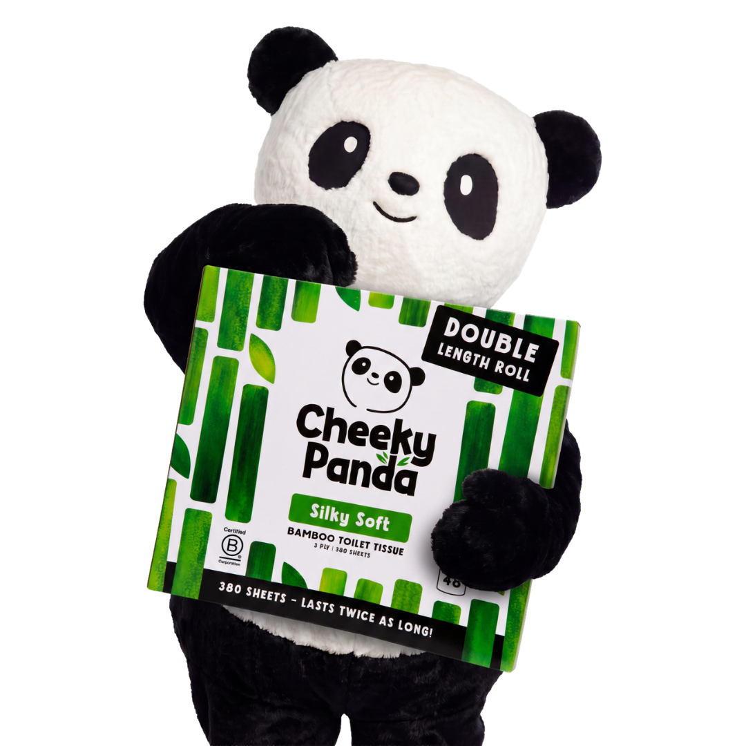 Cheeky Panda mascot holding a pack of Silky Soft double-length bamboo toilet tissue