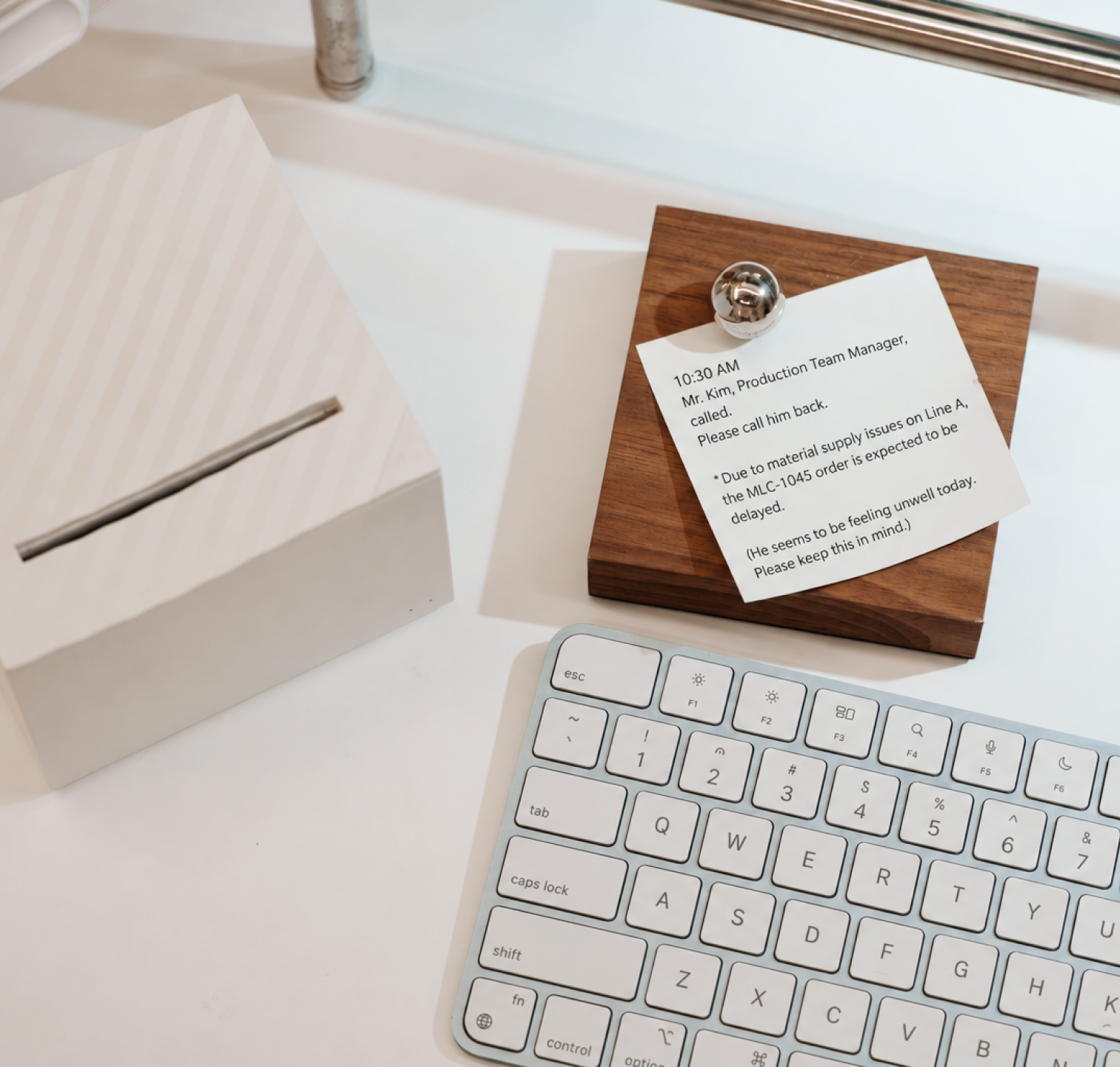 Printed notes stuck to a computer monitor