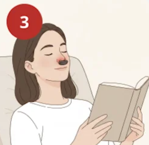 Step 3: woman relaxing with a book while the Fitora device glows red at her nose