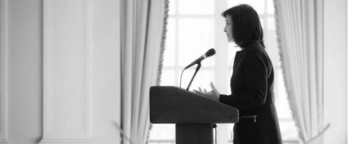 Francine Farkas Sears speaking at a podium