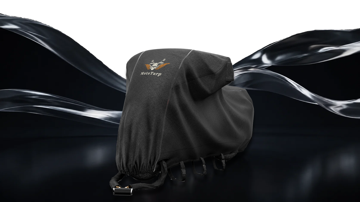 A MotoTarp cover fitted to a motorcycle, straps and vents visible
