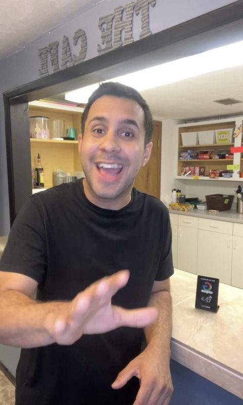 Steven Thompson, owner of Blackout Sports, in his store