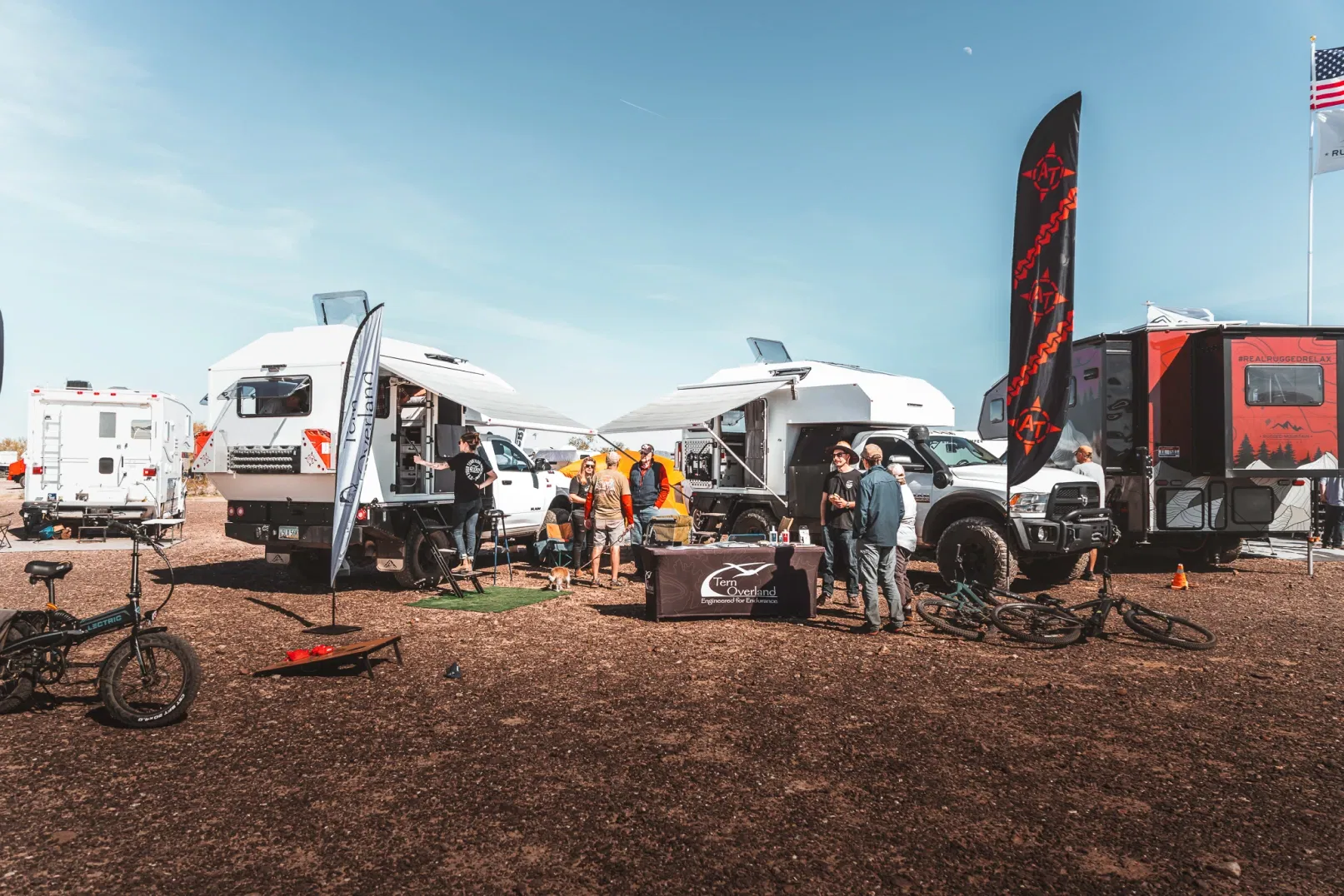 Overlanding vehicles at the 2024 Truck Camper Rally in the desert