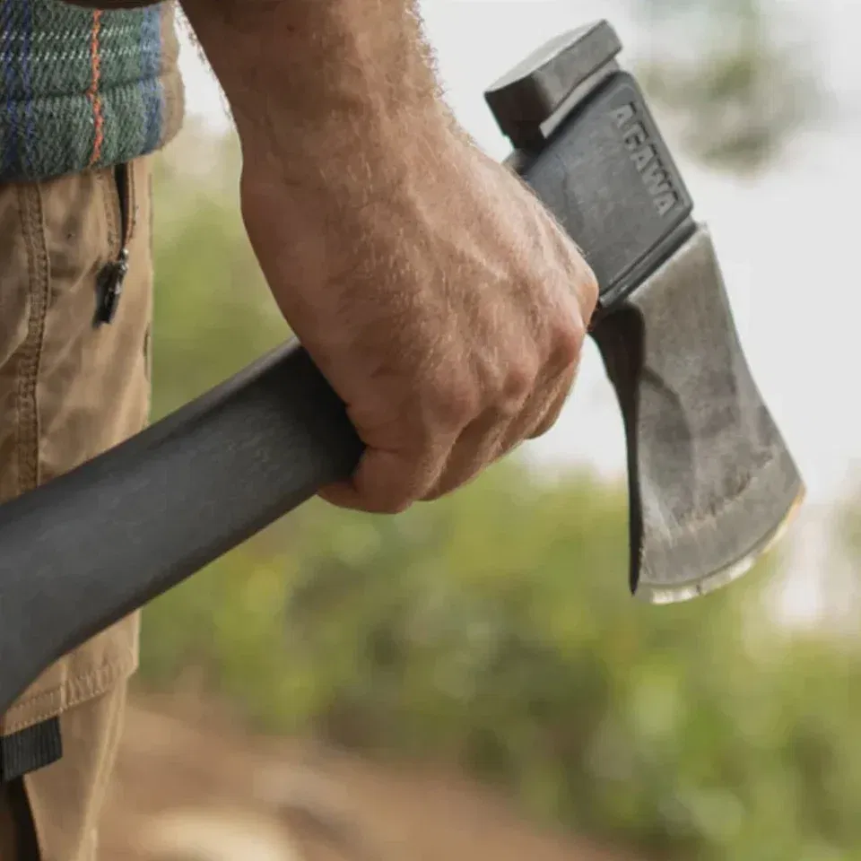 Person hold a black Agawa Axe while outdoors